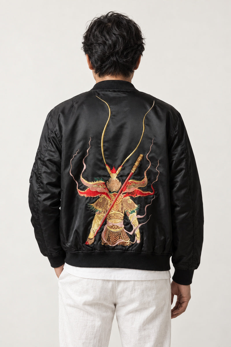 Fujin Wind God Bomber Jacket 'Kazabukuro' – back view of black bomber jacket showing the embroidered Fujin wind god with his wind bag