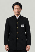 Gakuran 'Tsumeeri' – black gakuran Japanese boys' school uniform jacket with stand collar and gold buttons, front view on model