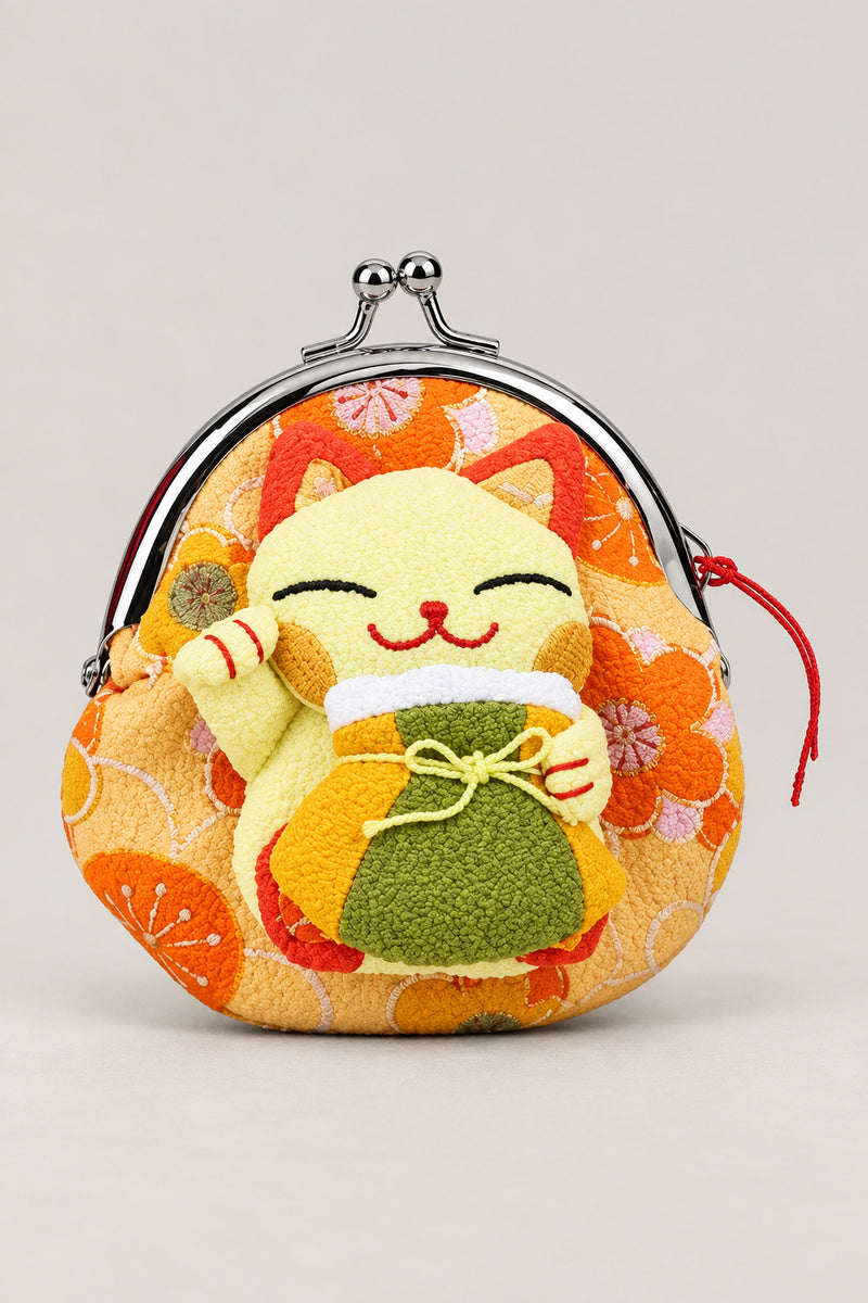 Gamagucci – yellow gamaguchi clasp purse with plush lucky cat holding a bag, Japanese coin purse, studio view