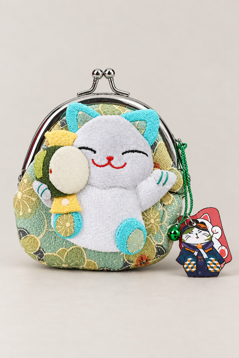 Gamagucci – light green gamaguchi clasp purse with plush lucky cat holding a ball, Japanese coin purse, studio view