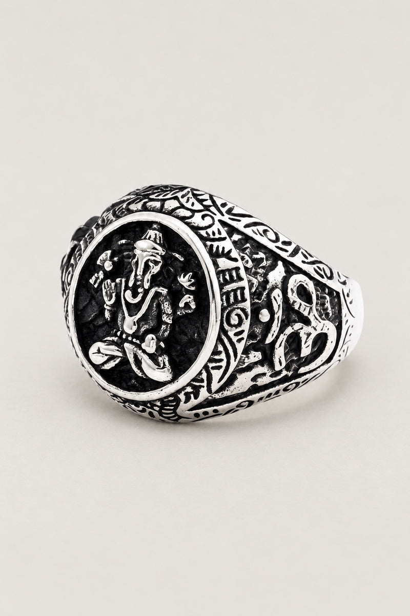 Ganesha Signet Ring 'Shoten' – stainless steel signet ring with seated elephant-headed Ganesha on oval face and Sanskrit shoulders, studio view
