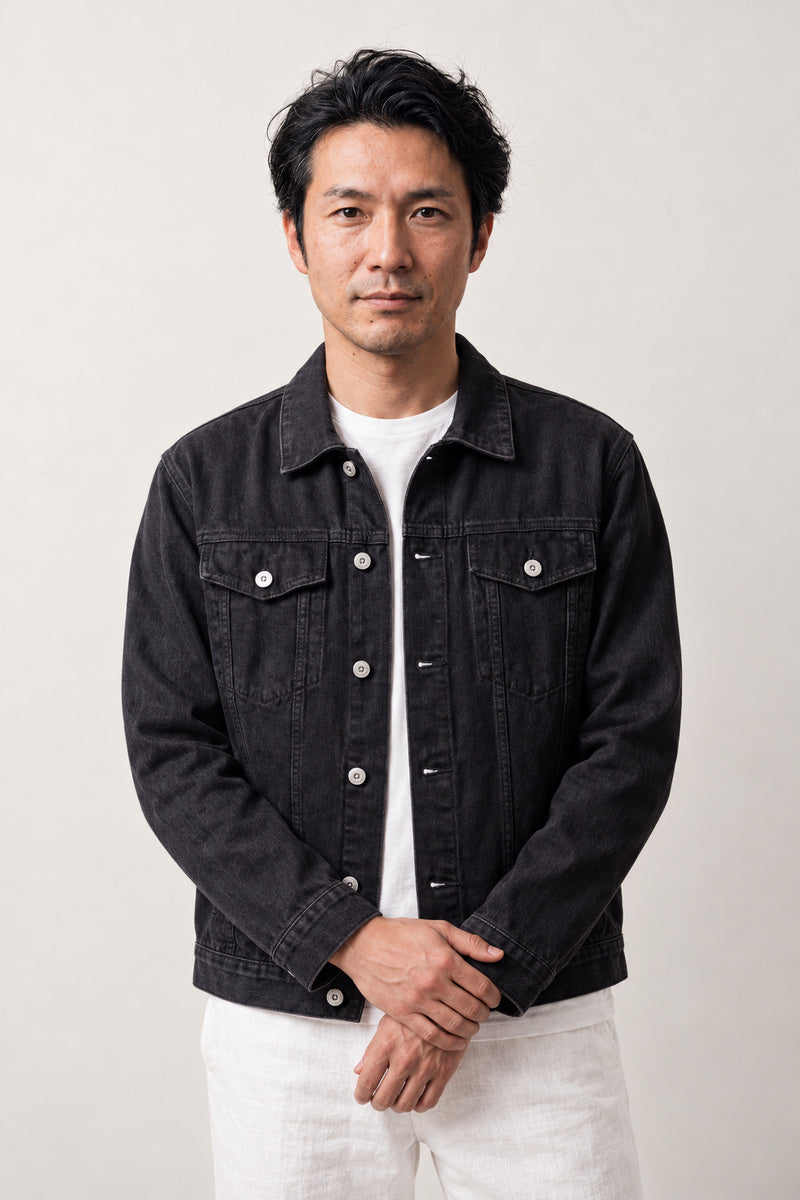 Glow Koi Embroidered Denim Jacket 'Hotaru' – black denim jacket with embroidered koi carp, Japanese streetwear denim jacket, front view on model