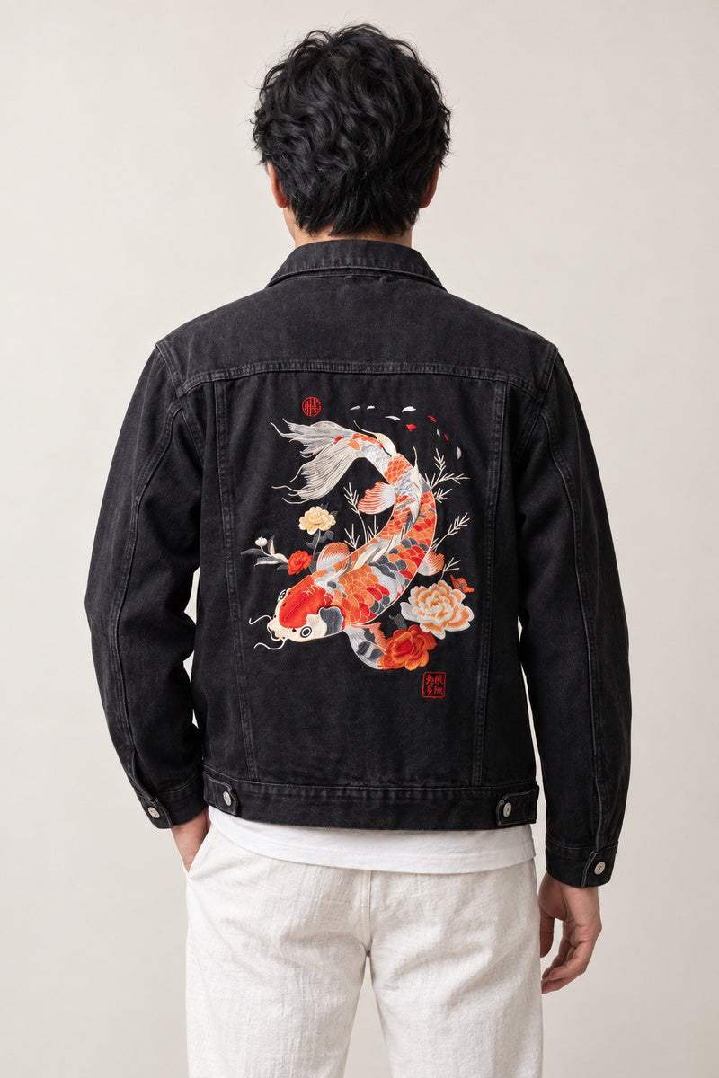 Glow Koi Embroidered Denim Jacket 'Hotaru' – back view of black denim jacket showing the embroidered koi carp and flowers