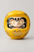 Gold Daruma Doll 'Fukudaruma' – yellow gold matte ceramic daruma doll with blank eyes to paint and a gold character on the belly, Japanese wishing doll, studio view