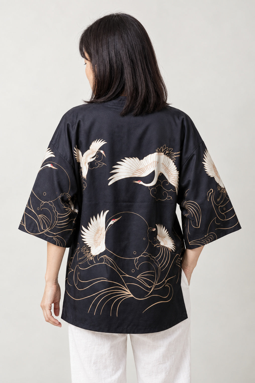 Gold Line Crane Kimono Jacket 'Kinpa' – back view of black kimono jacket with gold outlined cranes over waves