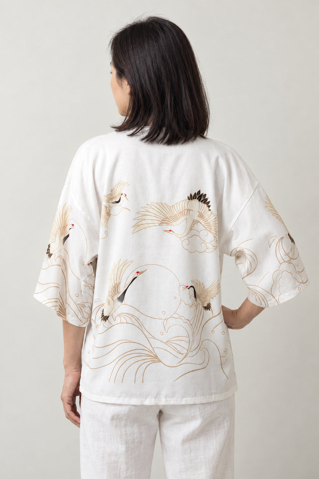 Gold Line Crane Kimono Jacket 'Kinpa' – back view of white kimono jacket with gold crane and wave line print