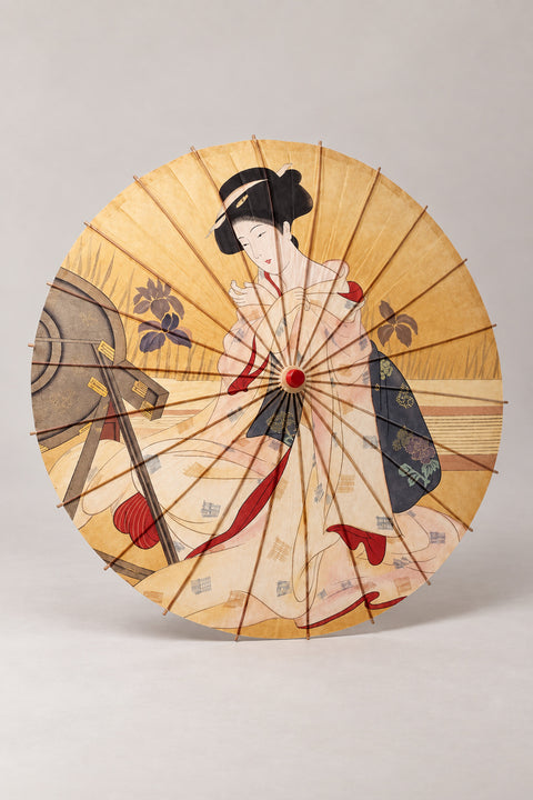 Golden Kimono Lady Umbrella 'Kinbijin' – golden parasol printed with a woman in pale kimono at her mirror in ukiyo-e style, Japanese wagasa parasol with wooden frame and paper-effect canopy, open, studio view