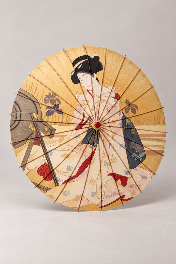 Golden Kimono Lady Umbrella 'Kinbijin' – golden parasol printed with a woman in pale kimono at her mirror in ukiyo-e style, Japanese wagasa parasol with wooden frame and paper-effect canopy, open, studio view