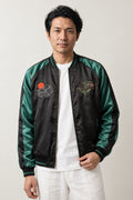 Green Bamboo Tiger Sukajan 'Takeyabu' – black sukajan with green satin-look sleeves and embroidered bamboo, Japanese sukajan souvenir bomber jacket, front view on model