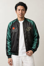 Green Bamboo Tiger Sukajan 'Takeyabu' – black sukajan with green satin-look sleeves and embroidered bamboo, Japanese sukajan souvenir bomber jacket, front view on model