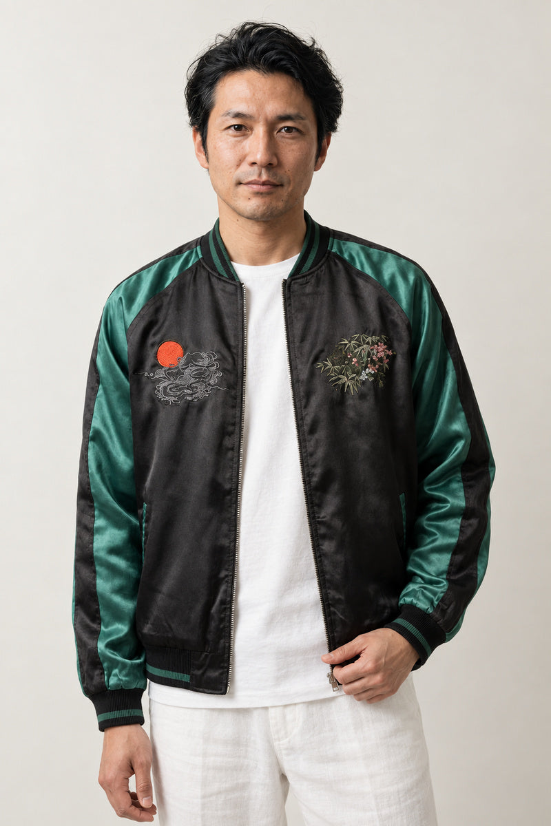Green Bamboo Tiger Sukajan 'Takeyabu' – black sukajan with green satin-look sleeves and embroidered bamboo, Japanese sukajan souvenir bomber jacket, front view on model