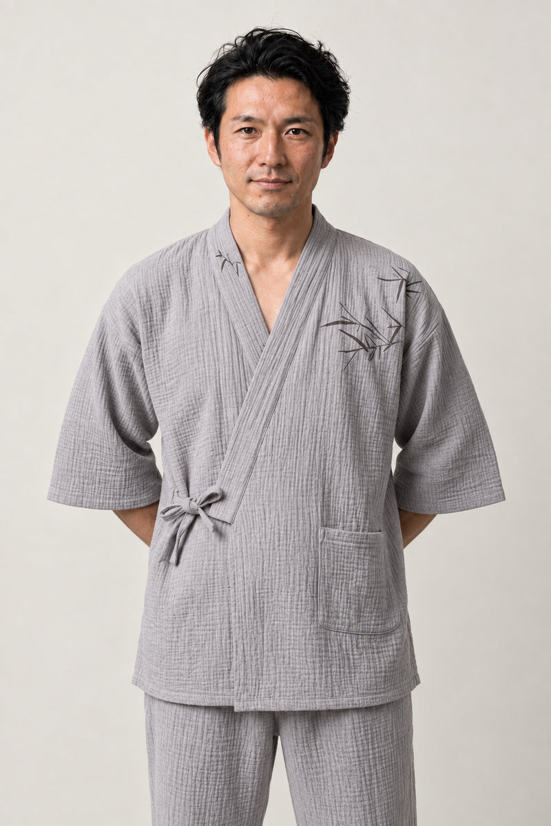 Grey Bamboo Japanese Pyjamas 'Madake' – light grey jinbei pyjamas with bamboo embroidery, unisex two-piece Japanese jinbei set with side-tie top and shorts, front view on model