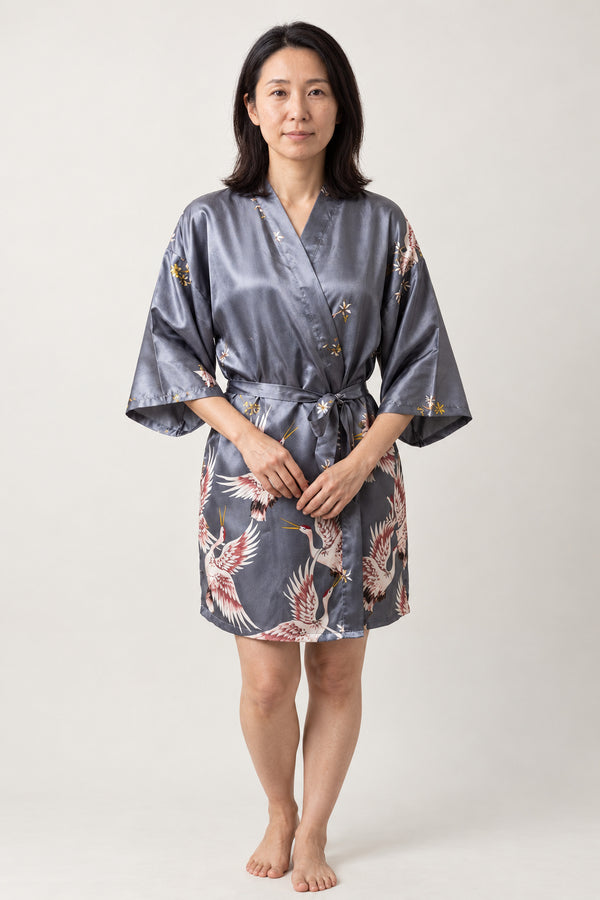 Grey Crane Japanese Sleep Robe 'Asazuru' – grey women's short satin-look kimono sleep robe with crane print and tie belt, Japanese dressing gown, front view on model