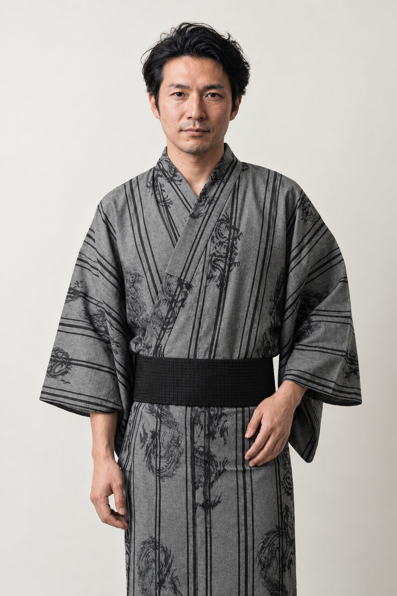 Grey Dragon Stripe Yukata 'Ryumon' – grey striped men's yukata with tonal dragon print and black obi belt, Japanese kimono robe, front view on model