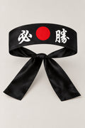 Hachimaki – black Japanese hachimaki headband with red sun and the kanji for certain victory, studio view
