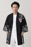 Hannya Mask Happi Coat 'Onryo' – black happi coat with hannya mask, dragon and wave print, Japanese happi coat, unisex festival jacket, front view on model