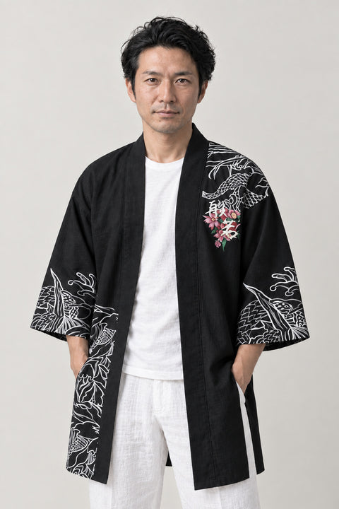 Hannya Mask Happi Coat 'Onryo' – black happi coat with hannya mask, dragon and wave print, Japanese happi coat, unisex festival jacket, front view on model