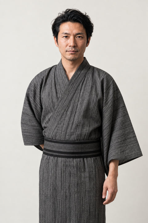 Heathered Grey Yukata 'Hainezumi' – heather grey men's yukata with dark obi belt, plain traditional Japanese kimono robe, full length, front view on model