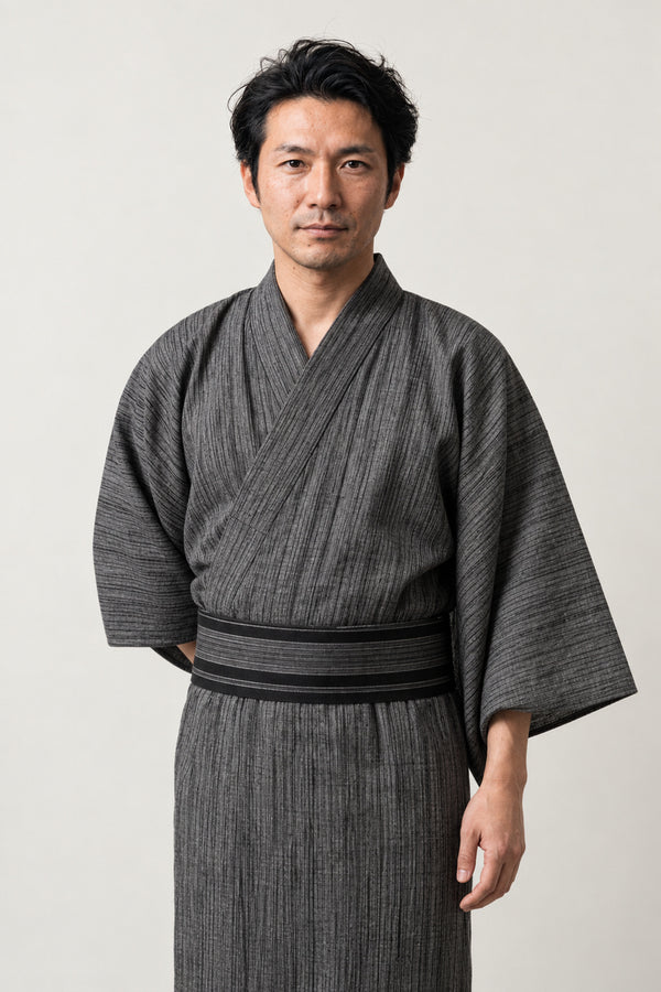 Heathered Grey Yukata 'Hainezumi' – heather grey men's yukata with dark obi belt, plain traditional Japanese kimono robe, full length, front view on model