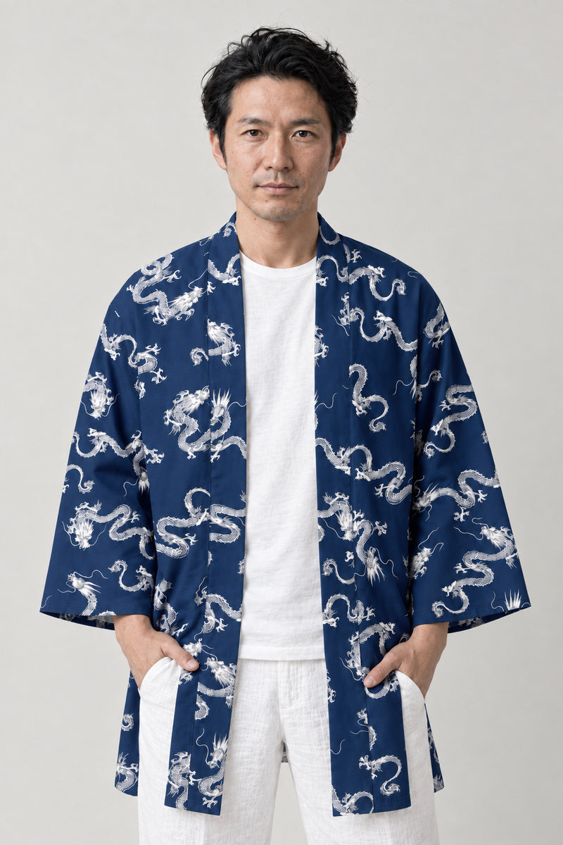 Indigo Dragon Pattern Happi 'Koryu' – indigo blue happi coat with white all-over dragon pattern print, Japanese happi coat, unisex festival jacket, front view on model