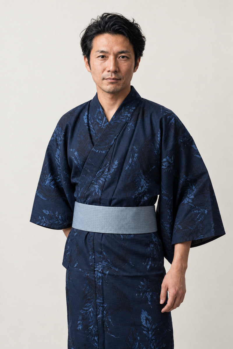 Indigo Foliage Kimono 'Konoha' – indigo navy men's kimono with tonal foliage print and grey obi belt, Japanese yukata robe, front view on model