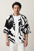 Ink Tiger Summer Haori 'Hitofude' – black and white ink brushstroke print summer haori, unisex Japanese kimono style cardigan, front view on model
