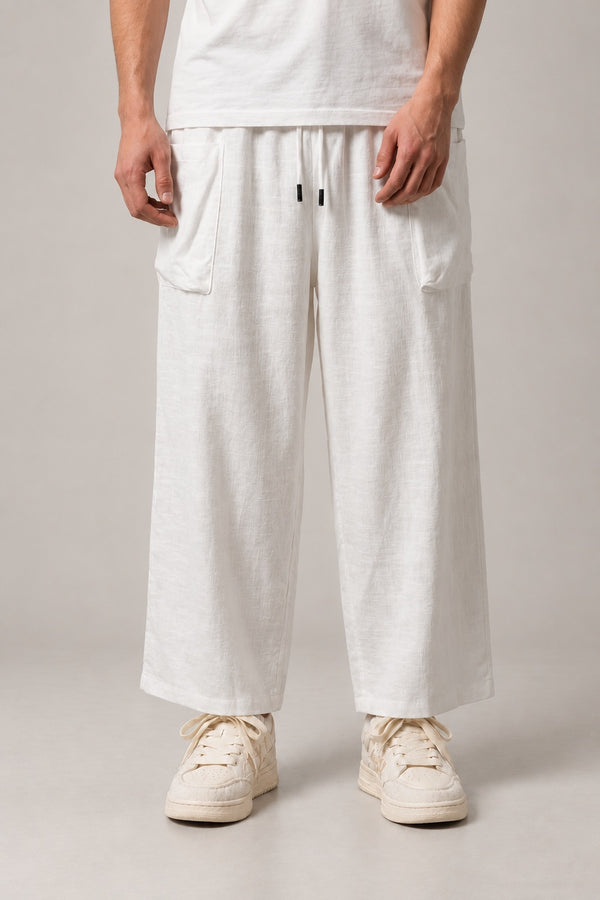 Ivory Wide Leg Hakama Trousers 'Hakuun' – ivory white wide leg hakama trousers with drawstring waist, Japanese linen-look palazzo pants, front view on model