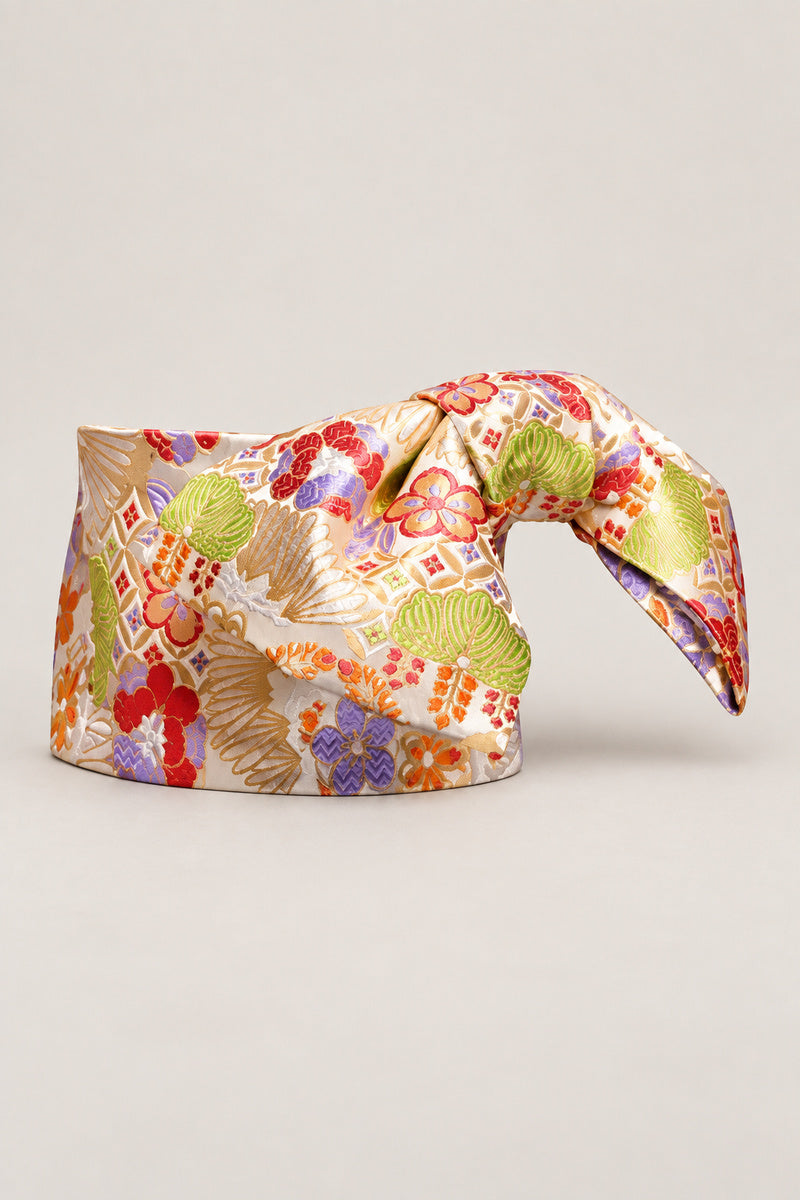 Ivory Wide Obi Belt 'Omon' – ivory brocade obi with green pine, red plum and hexagon lattice, wide pre-tied brocade obi belt with sewn bow for women's kimono or yukata, studio view