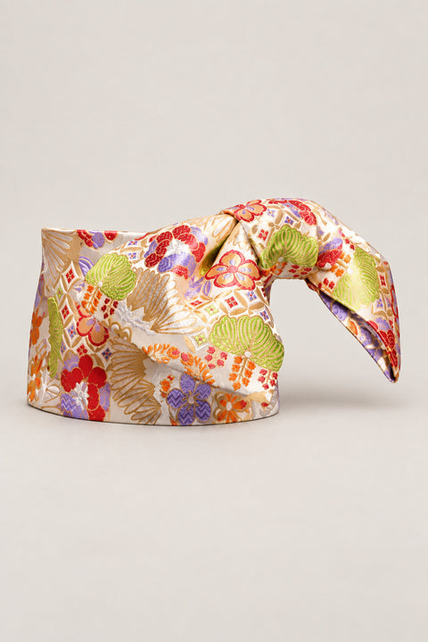 Ivory Wide Obi Belt 'Omon' – ivory brocade obi with green pine, red plum and hexagon lattice, wide pre-tied brocade obi belt with sewn bow for women's kimono or yukata, studio view