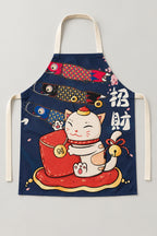 Japanese Apron – navy bib apron printed with a lucky cat, koi and fortune bag, Japanese maneki neko kitchen apron with neck loop and waist ties, studio view