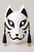 Japanese Cat Mask 'Bakeneko' – white mask with pointed ears, black cat markings, curled mouth and black tassels with bells, Japanese bakeneko festival mask, studio view