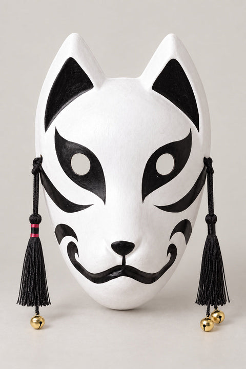 Japanese Cat Mask 'Bakeneko' – white mask with pointed ears, black cat markings, curled mouth and black tassels with bells, Japanese bakeneko festival mask, studio view