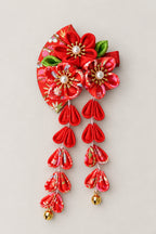 Japanese Hair Pin – red tsumami kanzashi hair clip with folded cloth flowers and hanging petal strands with bells, Japanese maiko hair ornament, studio view