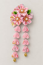 Japanese Hair Pin – pink tsumami kanzashi hair clip with cherry blossom cloth flowers and hanging strands, studio view