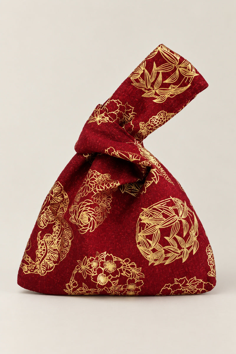 Japanese Knot Bag – wine red Japanese knot bag with gold flower crest print, kimono cloth handbag, studio view