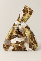 Japanese Knot Bag – gold Japanese knot bag with crane and chrysanthemum print, kimono cloth handbag, studio view