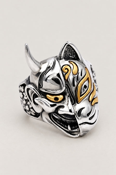 Japanese Mask Ring 'Nimen' – stainless steel two-faced mask ring with horned oni demon on one side and gold-marked kitsune fox on the other, Japanese mask ring, studio view