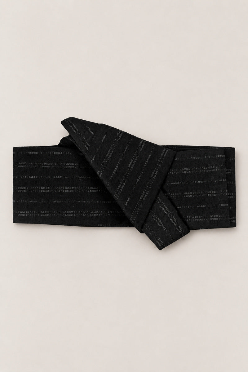 Japanese Obi Belt 'Kagemon' – black obi belt with faint tone-on-tone dash pattern, narrow pre-tied Japanese obi belt with sewn knot and hidden adjustable closure, for kimono, yukata or jinbei, studio view