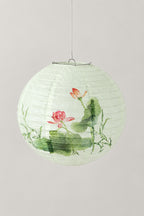 Japanese Paper Lantern 'Bonbori' – round white paper lantern printed with a pink lotus and green leaves, hanging Japanese lantern shade, studio view