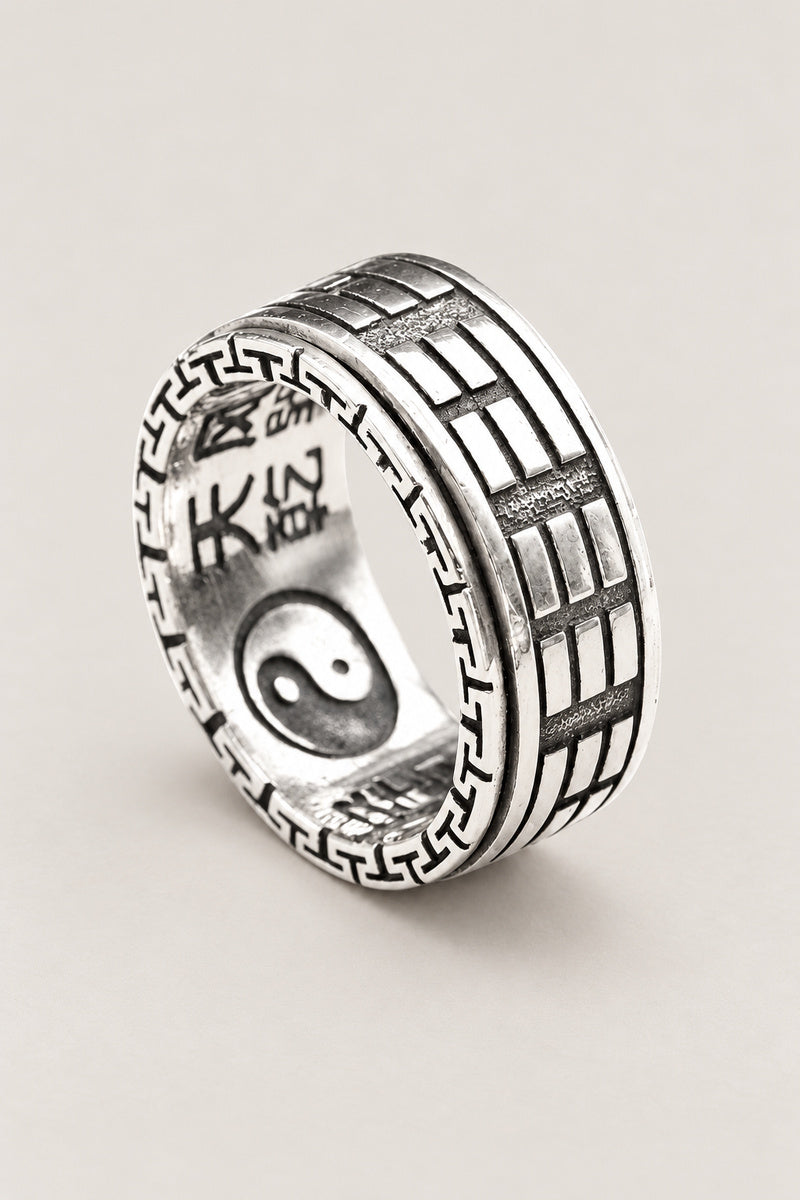 Japanese Ring 'Inyo' – wide sterling silver band ring carved with the eight trigrams and yin yang symbol, Japanese silver ring, studio view