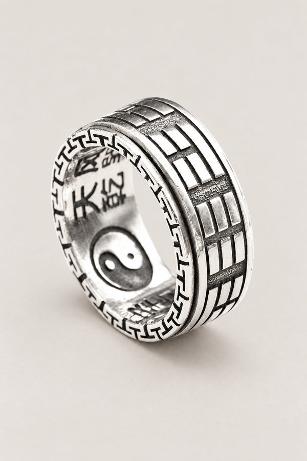 Japanese Ring 'Inyo' – wide sterling silver band ring carved with the eight trigrams and yin yang symbol, Japanese silver ring, studio view