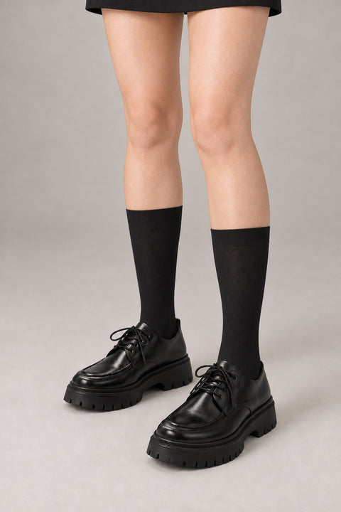 Japanese School High Socks 'Ashimoto' – black knee-high Japanese school socks worn with loafers, front view on model