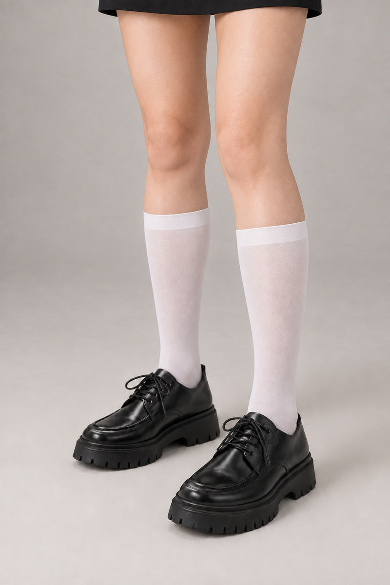 Japanese School High Socks 'Ashimoto' – white knee-high Japanese school socks worn with loafers, front view on model