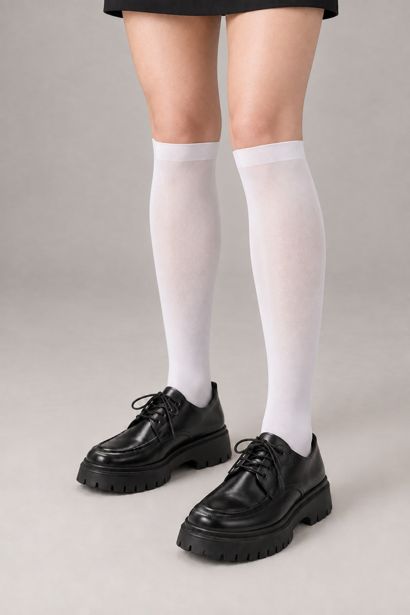 Japanese School High Socks 'Ashimoto' – white over-the-calf Japanese school socks worn with loafers, front view on model