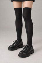 Japanese School High Socks 'Ashimoto' – black thigh-high Japanese school socks worn with loafers, front view on model