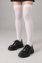 Japanese School High Socks 'Ashimoto' – white thigh-high Japanese school socks worn with loafers, front view on model