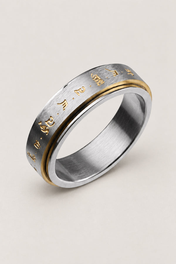 Japanese Spinner Ring 'Mawari' – stainless steel spinner ring with brushed inner band and gold Sanskrit engraved outer band, Japanese anxiety ring, studio view
