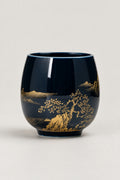 Japanese Tea Cup 'Yunomi' – deep blue glazed yunomi tea cup with gold landscape of pines, hills and a boat, Japanese handleless tea cup, studio view