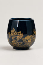 Japanese Tea Cup 'Yunomi' – deep blue glazed yunomi tea cup with gold landscape of pines and a pavilion, Japanese handleless tea cup, studio view