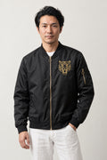 Japanese Tiger Bomber Jacket 'Kinko' – black MA-1 style bomber jacket with small embroidered gold tiger head, Japanese streetwear, front view on model